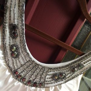 Little black dress with an embellished top.